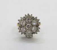 Diamond cluster ring comprising a cluster of six round brilliant cut diamonds, each of approx 4.