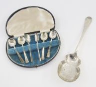 Set of six silver coffee spoons, cased, 1940, and a Victorian silver fruit serving spoon with shaped