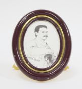 Les Must de Cartier Quartz easel back photograph frame, of oval form, in a brown lacquered and