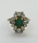 Art Deco 18ct white gold and platinum, emerald and diamond set ring comprising a central claw set