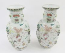 Pair of Chinese porcelain famille rose 'One Hundred Antiques' relief-moulded oviform vases, Qing