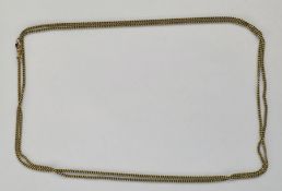 Gold coloured metal guard chain, unmarked, 30.3g, 61cm long (acid-tested)