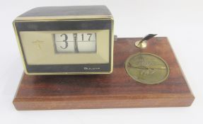 1960s Bulova desk clock on teak base inset with a commemorative Boeing 747 Rollout medal