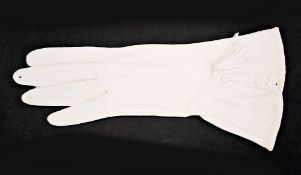 Contemporary white biscuit porcelain trompe l'oeil faux-kid glove, with tasselled moulding,