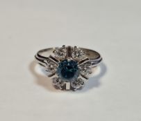 18ct white gold, diamond and blue zircon cluster ring, the centre zircon having surround of 6