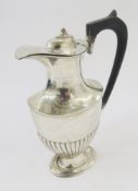 Silver hot water jug, oval baluster shape and semi-gadrooned, Chester 1914, 14ozt approx.