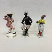 Three 18th or 19th century Meissen style porcelain Blackamoor figures or allegories of Africa.