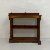A 19th century Empire style mahogany console table or open shelving unit having a rectangular top
