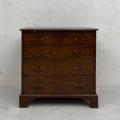 A Georgian mahogany bachelor's chest of small proportions having a thumb-moulded top with brushing