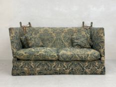 A vintage Victorian style Knoll drop arm two seater sofa having a square back and arms over a deep