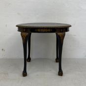 A Georgian style black lacquered chinoiserie occasional table having a circular hand painted and