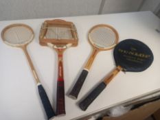 A collection of four vintage Slazenger and Dunlop squash and tennis rackets.