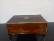A Regency rosewood brass bound campaign style writing slope. 41x25x13cm. (Central brass inset