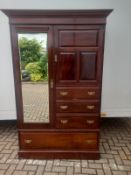 A 19th century walnut compactum wardrobe with Harrod's label to the back. (Comes in two main