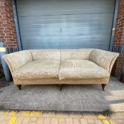 A contemporary sofa in the 19th century style in cut foliate upholstery with large feather filled