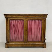 A 19th century figured walnut pier cabinet with satinwood inlay and ormolu mounted decoration on