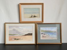 A miscellaneous collection of three watercolour studies each depicting a beach scene, framed and