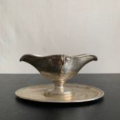 A late 19th or early 20th century Austrian or Hungarian .800 silver sauce boat on stand with
