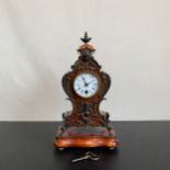 A 20th century gilt metal mounted French style walnut Lenzkirch mantle clock with urn finial and