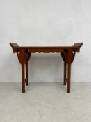 A Chinese hardwood alter or console table on stretchered square section supports. 91x123x38cm