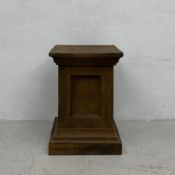 A moulded faux stone garden pedestal. H.59 W.42 D.42cm