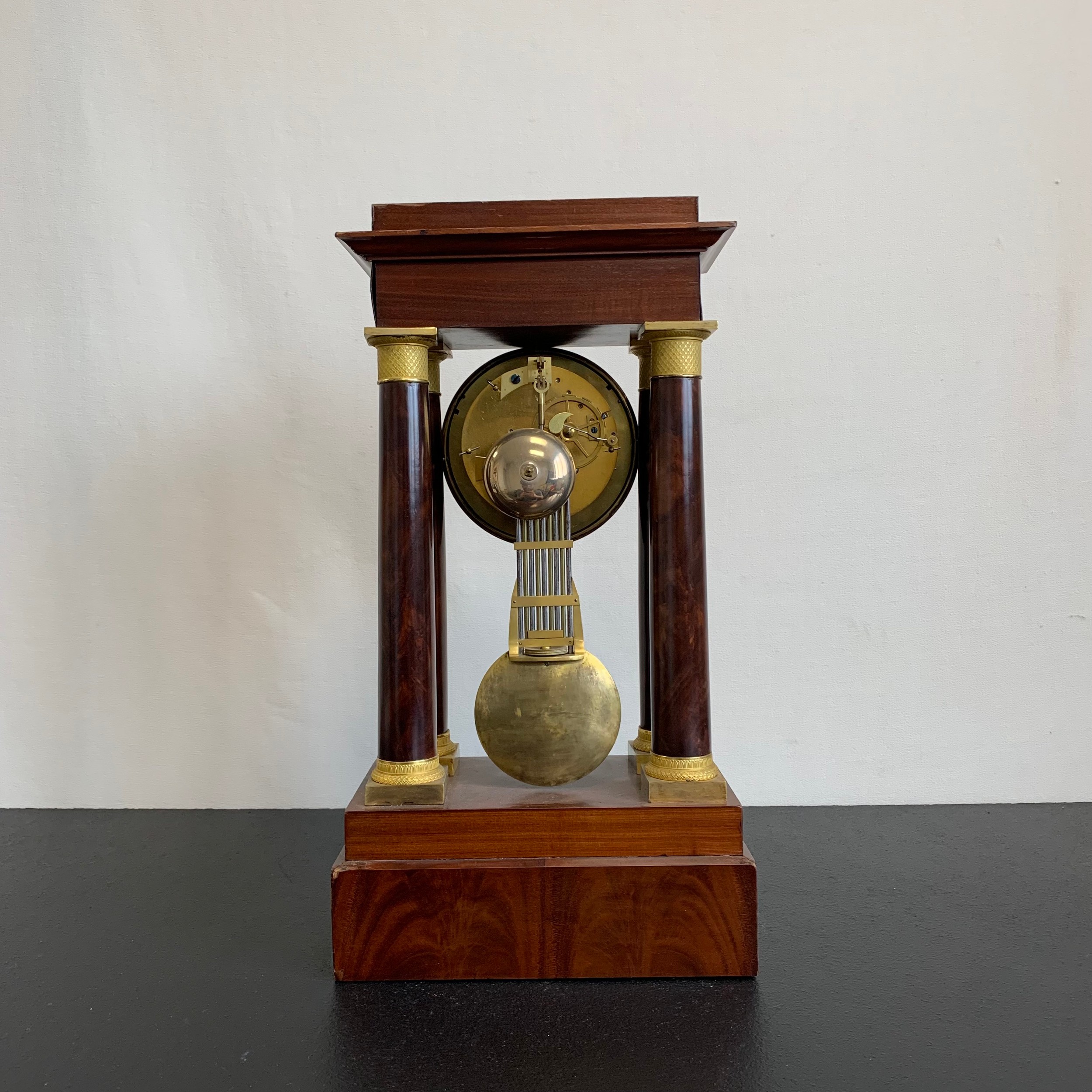 A 20th century gilt metal mounted French Empire style mahogany portico clock having a moulded - Image 6 of 7