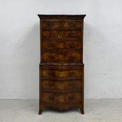 An early 20th century Georgian style crossbanded mahogany chest on chest in two sections of