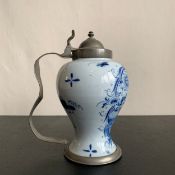 A possibly 18th century pewter mounted blue and white Dutch delftware or German feiance jug or