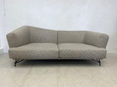 A contemporary Ditre Italia sofa of asymmetric shape on metal supports. H.86 W.210 D.107cm. (Low