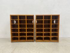 A pair of mid century light oak filing cabinets each fitted with fifteen recessed pigeon holes. H.81