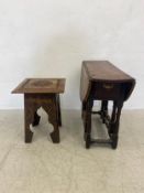 A carved Eastern occasional table and an 18th century country oak drop flap dining table with gate-
