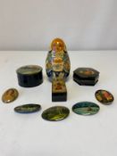 A collection of five signed and hand painted Russian papier mache oval pin badges along with three