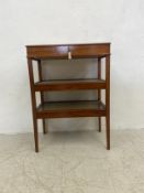 An Edwardian mahogany vitrine with glazed upper section with lift out tray above two further