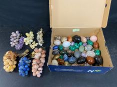 A collection of mineral and polished stone bunches of grapes and eggs, marble onyx and others etc.