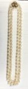 A cultured pearl necklace with 14ct gold clasp fastener and safety chain. L.102cm