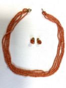 A pair of 18ct gold and coral clip-on earrings and a coral necklace with 9ct gold clasp, earrings
