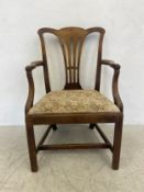 A Georgian mahogany open armchair with pierced splat and drop-in seat on square stretchered