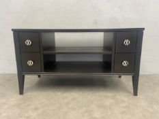 A contemporary John Lewis black lacquered small sideboard or TV or HI-FI cabinet with retailer's