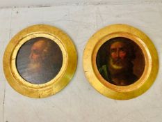 A pair of early 20th century Italian school oil paintings on board, portraits of saints, in gilt