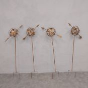 A set of four metal garden stakes with armillary sphere finials. 115 x 39 x 17cm