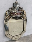 A vintage Venetian style wall mirror with foliate etched glass cresting and panels. 94x52cm.