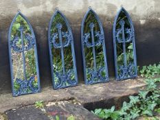A set of four Gothic style wall mirrors in arched foliate painted metal frames. 60x21cm.