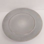 A large mid-century coil built ceramic studio pottery charger with a pearlescent glaze. Dia.56cm
