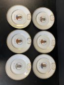 A set of six early 20th century hand painted and gilt porcelain plates with portraits of