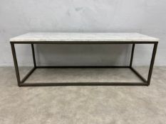 A contemporary coffee table with white marble and composite top raised on a square tubular base. H.