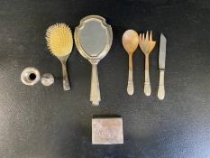 A mixed collection of silver to include a tulip vase, a vanity brush and mirror, a serving spoon,