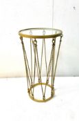 A contemporary gold painted side table or jardiniere with circular glass top raised on faux rope