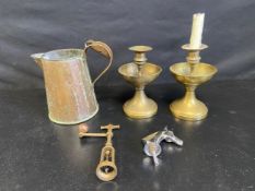 A mixed lot to include an early 20th century copper jug, a pair of brass candlesticks, an Italian