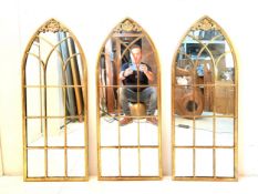 A set of three Gothic style gilt metal arched plate architectural wall mirrors. 102x40cm.
