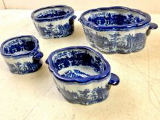 A set of four Victorian style blue and white porcelain planters, various sizes. 44x29cm. (Largest).